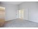Neutral bedroom with carpet and open closet with easy access at 18508 E Whitaker Cir # D, Aurora, CO 80015
