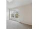 Bright bedroom features carpet floors and a window with patterned lattice at 18508 E Whitaker Cir # D, Aurora, CO 80015