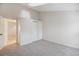 Minimalist bedroom featuring carpet floors, closet, and a bright skylight at 18508 E Whitaker Cir # D, Aurora, CO 80015