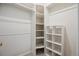 Walk-in closet featuring shelving and bars for optimal storage solutions at 18508 E Whitaker Cir # D, Aurora, CO 80015