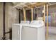 Bright laundry room with modern washer and dryer, offering convenience and functionality at 18508 E Whitaker Cir # D, Aurora, CO 80015