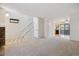 Bright, open floor plan featuring a living room, dining area, and staircase at 18508 E Whitaker Cir # D, Aurora, CO 80015