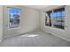 Bright bedroom with two windows offering plenty of natural light and neighborhood views at 8632 Yule St, Arvada, CO 80007
