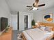 Comfortable bedroom with a ceiling fan, closet, and a neutral color palette at 8632 Yule St, Arvada, CO 80007