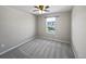 Comfortable bedroom with a ceiling fan and a window overlooking the neighborhood at 8632 Yule St, Arvada, CO 80007