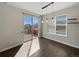 Dining room with a sliding glass door to the deck and stylish pendant lighting at 8632 Yule St, Arvada, CO 80007