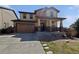Charming two-story home with a covered front porch and attached two-car garage at 8632 Yule St, Arvada, CO 80007