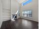Bright living room boasts high ceilings, a fireplace, and lots of natural light at 8632 Yule St, Arvada, CO 80007