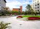 Relaxing courtyard featuring manicured lawns, vibrant flower beds, and comfortable seating at 1625 Larimer St # 1001, Denver, CO 80202