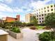 Beautifully landscaped courtyard with lush greenery, seating areas, and tranquil ambiance at 1625 Larimer St # 1001, Denver, CO 80202