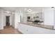 Open kitchen featuring stainless steel appliances and stone countertops at 1625 Larimer St # 1001, Denver, CO 80202