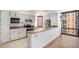 Stylish kitchen with stainless steel appliances and a breakfast bar at 1625 Larimer St # 1001, Denver, CO 80202