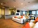 Open-concept living area with stylish furnishings, a fireplace, and floor-to-ceiling windows at 1625 Larimer St # 1001, Denver, CO 80202