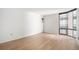 Bright and modern living room with sleek hardwood flooring and large windows at 1625 Larimer St # 1001, Denver, CO 80202