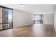 Bright living room with light wood floors, expansive windows, and city views at 1625 Larimer St # 1001, Denver, CO 80202