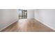 Spacious living room with hardwood floors, large windows, and natural light at 1625 Larimer St # 1001, Denver, CO 80202