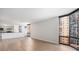 Open-concept living space with hardwood floors and city views at 1625 Larimer St # 1001, Denver, CO 80202