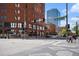 Street view of a lively downtown neighborhood with charming brick buildings and pedestrian walkways at 1625 Larimer St # 1001, Denver, CO 80202