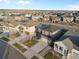 Birds eye view of a neighborhood showcasing the homes, driveways, yards, and street layout in a suburban area at 18014 Tree Sparrow Ave, Parker, CO 80134