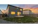 A serene backyard featuring a patio, lush lawn, and privacy fence, ideal for relaxation and outdoor activities at 18014 Tree Sparrow Ave, Parker, CO 80134