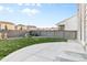 Well-maintained backyard with a concrete patio, grassy area, garden bed, and privacy fence, great for outdoor living at 18014 Tree Sparrow Ave, Parker, CO 80134
