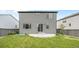 Fenced backyard with a well-maintained lawn, concrete patio, and low maintenance gravel landscaping at 18014 Tree Sparrow Ave, Parker, CO 80134