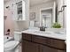 Bathroom features a single vanity, white quartz countertops, and cabinet storage at 18014 Tree Sparrow Ave, Parker, CO 80134