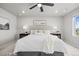 Spacious primary bedroom featuring a ceiling fan and windows with neighborhood views at 18014 Tree Sparrow Ave, Parker, CO 80134