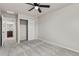 Bedroom features neutral carpet, ceiling fan, and closet with sliding doors at 18014 Tree Sparrow Ave, Parker, CO 80134