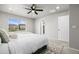Spacious primary bedroom featuring a ceiling fan and windows with neighborhood views at 18014 Tree Sparrow Ave, Parker, CO 80134