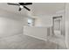 Bonus room with neutral carpet, ceiling fan, and great natural light at 18014 Tree Sparrow Ave, Parker, CO 80134