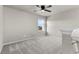 Bonus room with neutral carpet, ceiling fan, and great natural light at 18014 Tree Sparrow Ave, Parker, CO 80134
