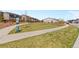 Community dog park featuring a grassy area and waste station for pet owners at 18014 Tree Sparrow Ave, Parker, CO 80134