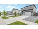 Suburban house with a two-car garage and well-maintained lawn in a quiet neighborhood at 18014 Tree Sparrow Ave, Parker, CO 80134