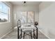 Home office featuring neutral colors, modern desk, and a large window for plenty of natural light at 18014 Tree Sparrow Ave, Parker, CO 80134