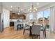 Bright kitchen and dining area with stainless steel appliances and backyard access at 18014 Tree Sparrow Ave, Parker, CO 80134