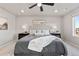 Main bedroom features a decorative rug, fan, plush headboard, and lots of natural light at 18014 Tree Sparrow Ave, Parker, CO 80134
