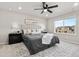 Main bedroom features a decorative rug, fan, plush headboard, and lots of natural light at 18014 Tree Sparrow Ave, Parker, CO 80134