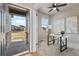 Bright office space with a modern desk and a view of the front yard at 18014 Tree Sparrow Ave, Parker, CO 80134