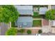 Aerial view of residential property featuring a well-manicured lawn and fenced backyard at 900 Jackson St, Denver, CO 80206
