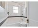 The bathroom has subway tile throughout and an updated shower at 900 Jackson St, Denver, CO 80206