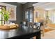 Dining Room features hardwood floors and a glass door leading to a light-filled Living Room with a fireplace at 900 Jackson St, Denver, CO 80206