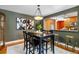 The dining area boasts hardwood floors and seamless connection to the kitchen through an open bar at 900 Jackson St, Denver, CO 80206