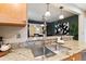 This Kitchen showcases Granite Countertops and a view to the dining area at 900 Jackson St, Denver, CO 80206