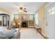 Cozy living room featuring a fireplace, built-in shelving, and ample natural light at 900 Jackson St, Denver, CO 80206