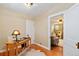 Charming office space with hardwood floors, natural light, and view of living area at 900 Jackson St, Denver, CO 80206