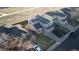 This aerial view showcases a gray house with mature landscaping in the neighborhood at 180 S Carlton St, Castle Rock, CO 80104
