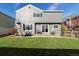 Well-maintained backyard with a lush lawn, patio area, outdoor furniture, and a grill for outdoor entertaining at 180 S Carlton St, Castle Rock, CO 80104