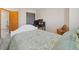 This bedroom features neutral carpet, a white bed frame, and a desk setup at 180 S Carlton St, Castle Rock, CO 80104