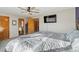 Spacious bedroom featuring a ceiling fan, and easy access to bathroom at 180 S Carlton St, Castle Rock, CO 80104